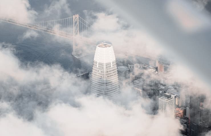 Picture of Salesforce building surrounded by clouds